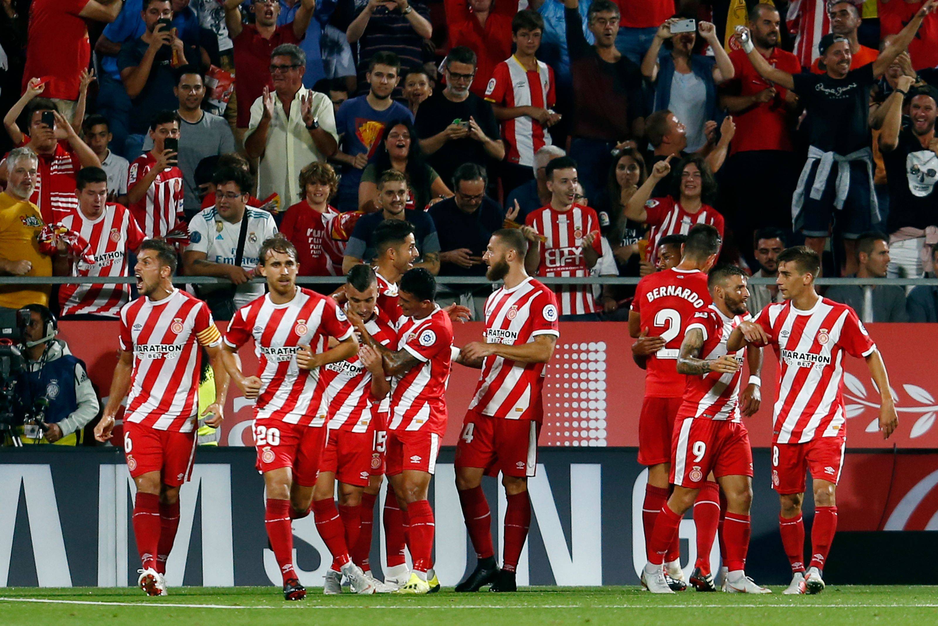 包含赫罗那客场轻松过关，保持不败势头的词条